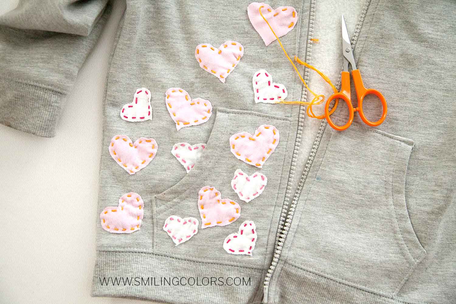 handsewn-hearts-on-a-sweatshirt