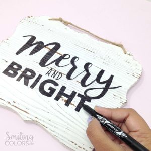 DIY hand lettered wood sign with a pen marker tombow