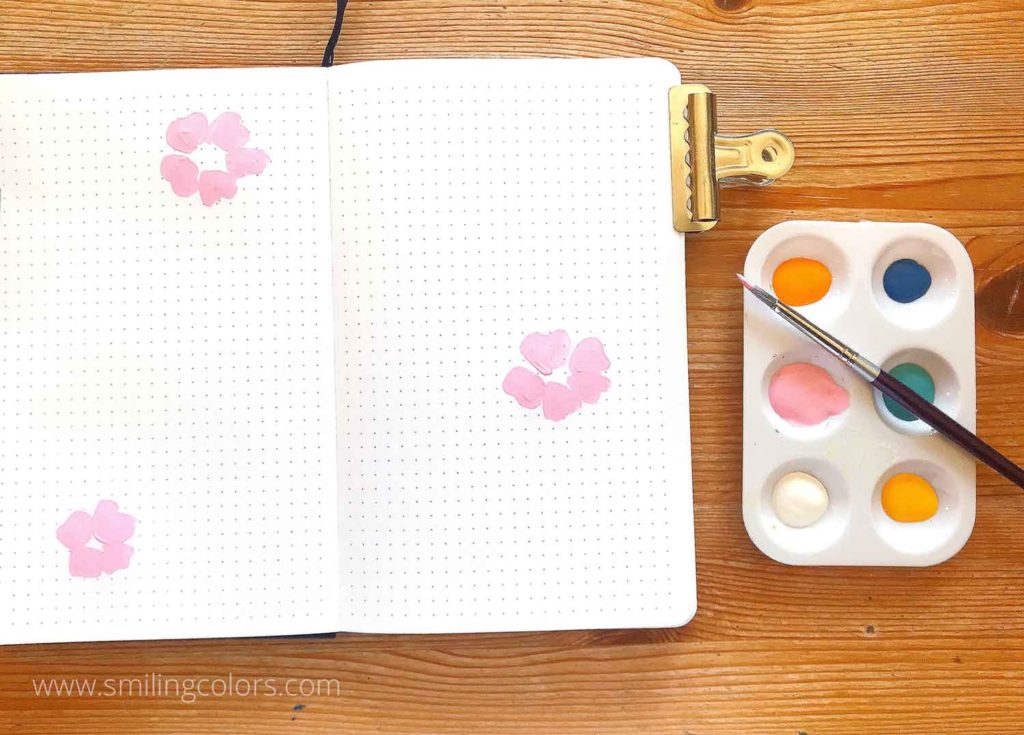 painting flowers in a sketchbook step1