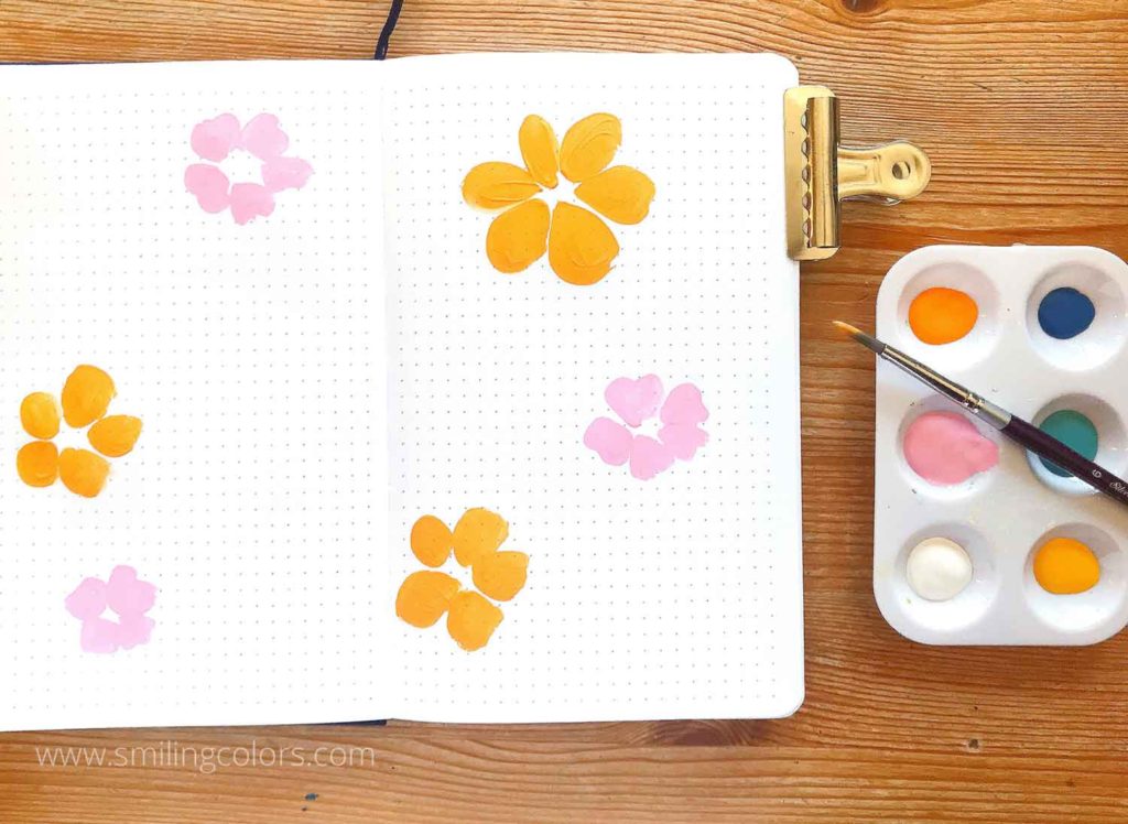 painting flowers in a sketchbook step2