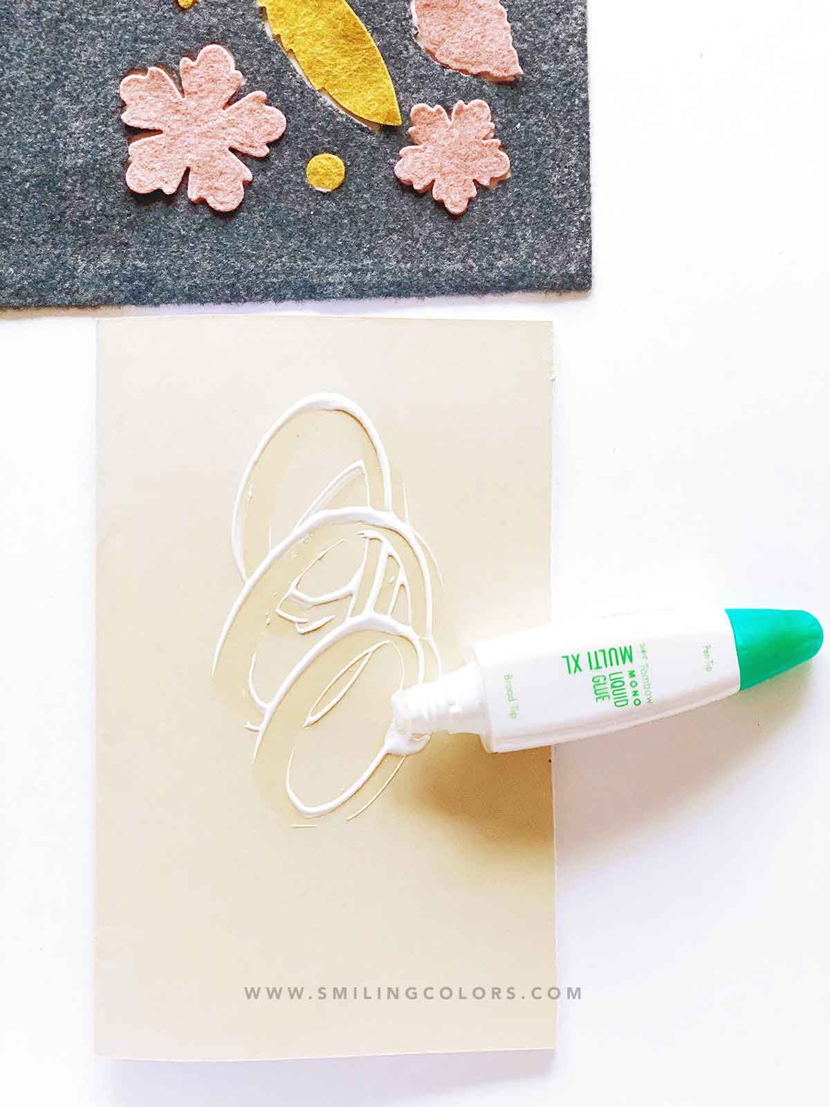 adhering felt to paper