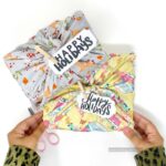 wrapping a gift with fabric