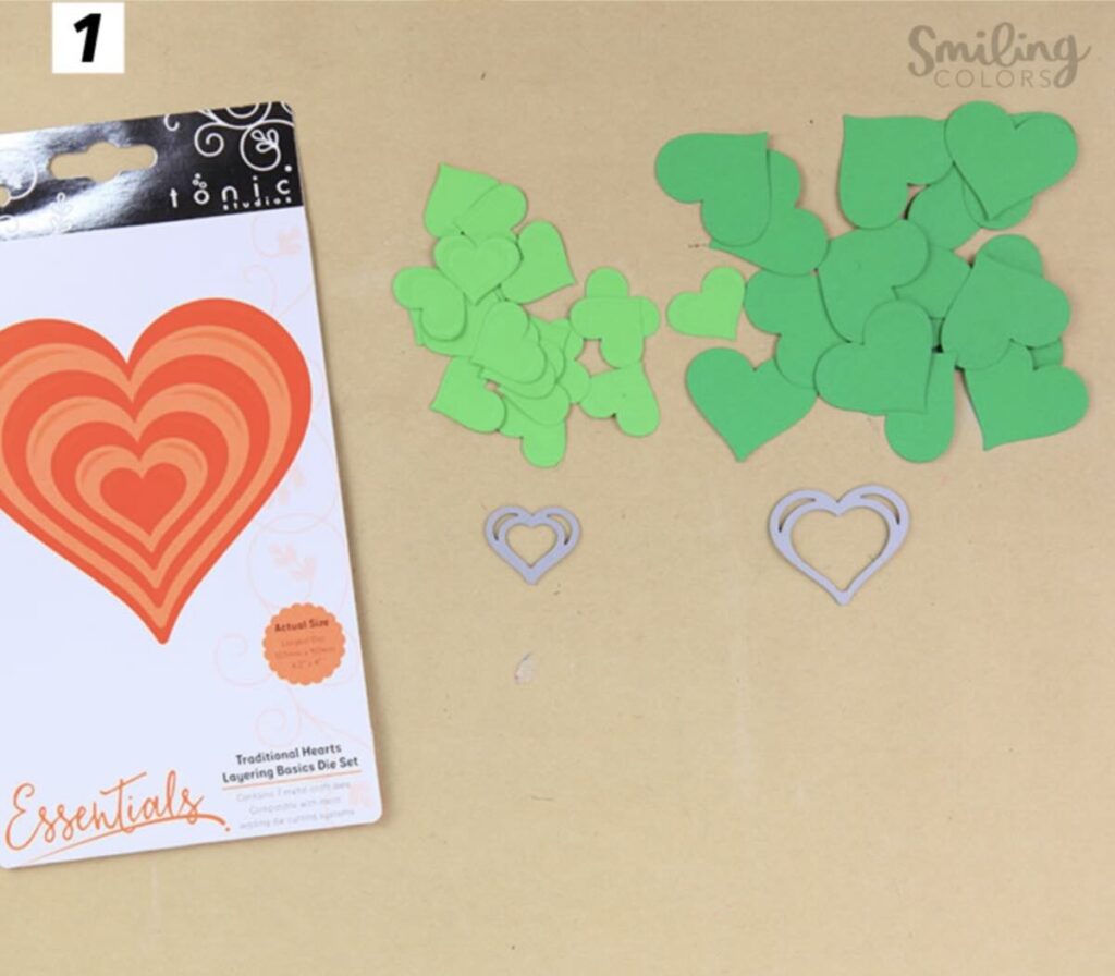 die cutting green hearts of two sizes