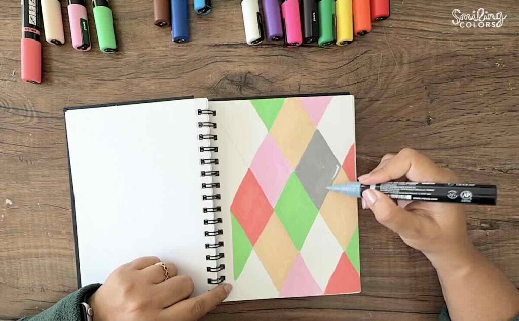 posca paint markers in sketchbook